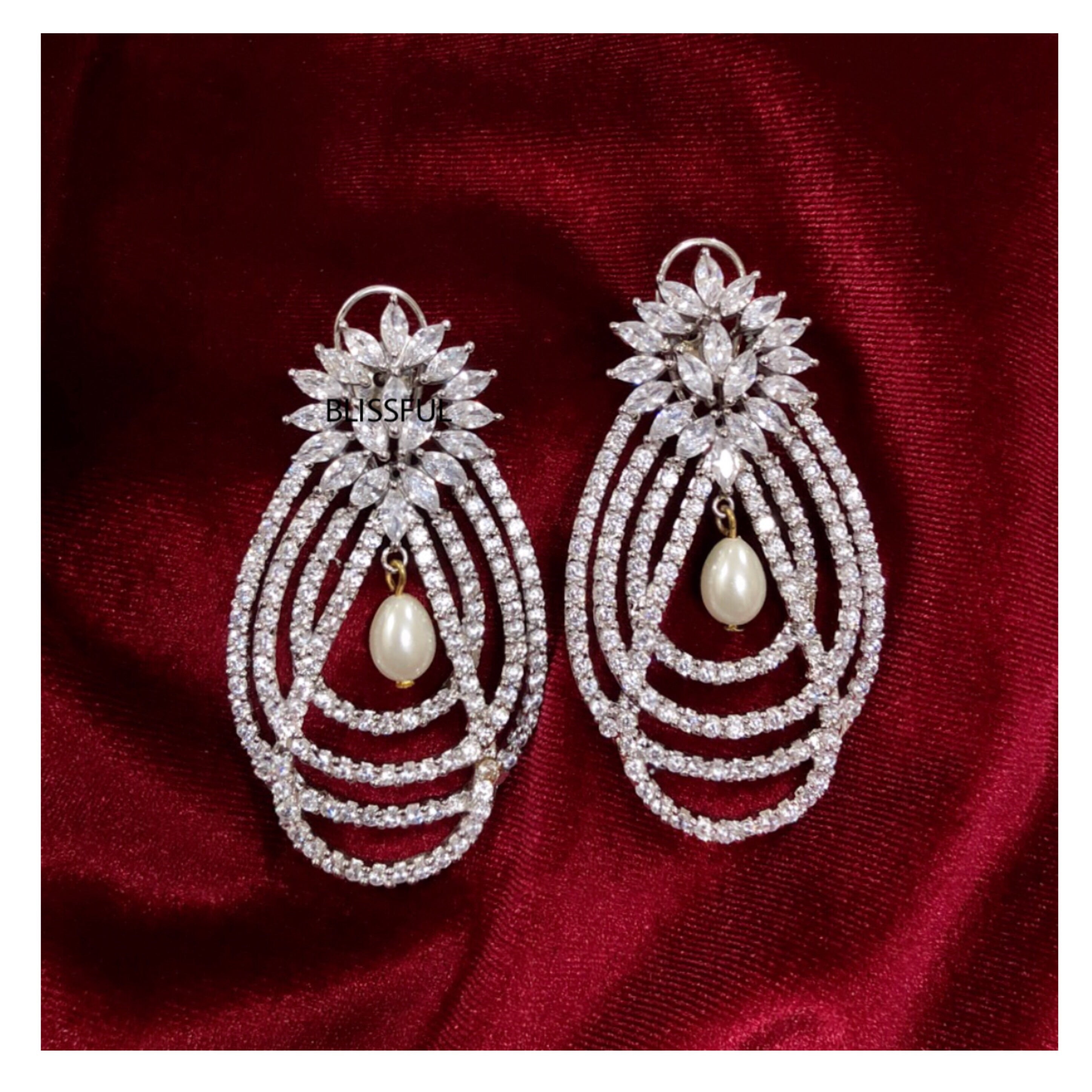 CZ Elegance Heavily Embellished Chandelier Earrings – VOYLLA